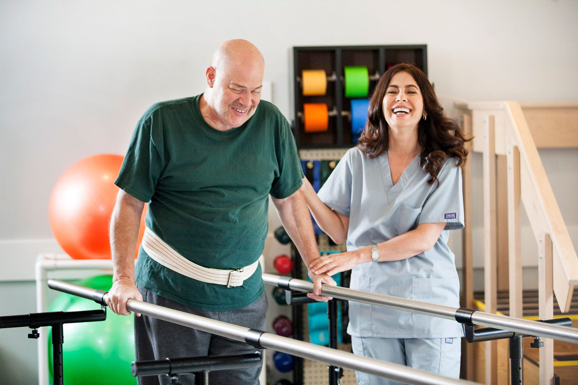 patient relearning to walk with help from occupational therapist