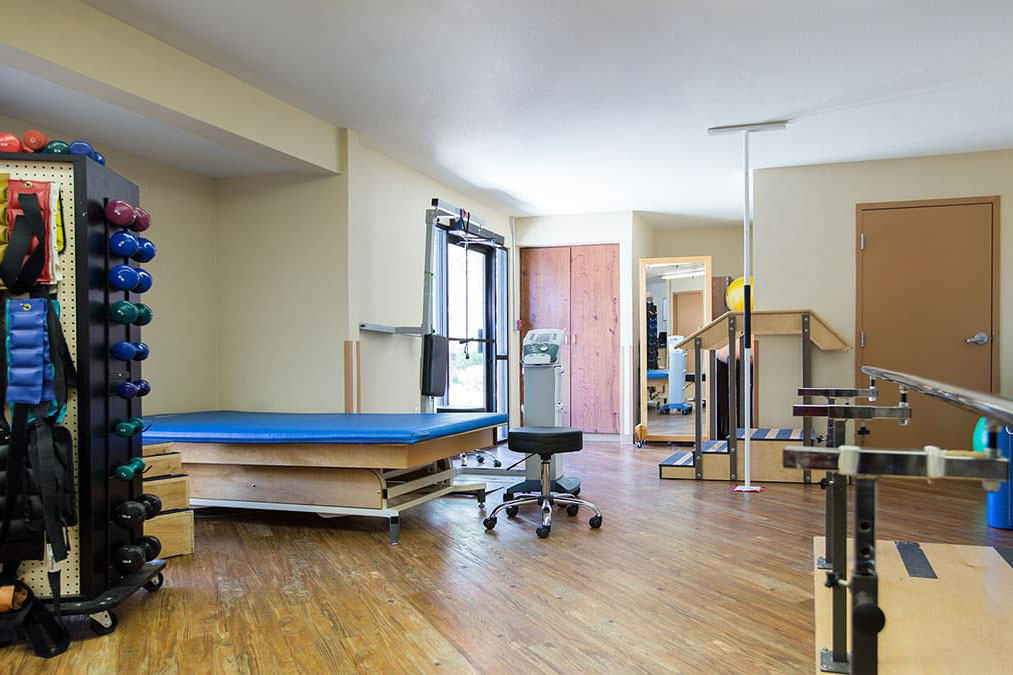 A communal workout room equipped with weights