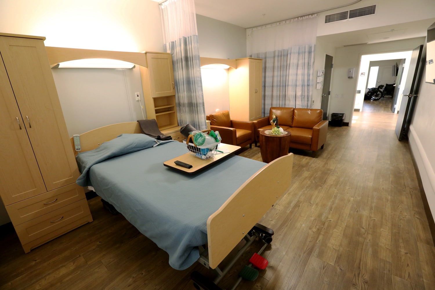 patient room with bed, and comfortable seating area at Haven Health Sierra Vista skilled nursing facility