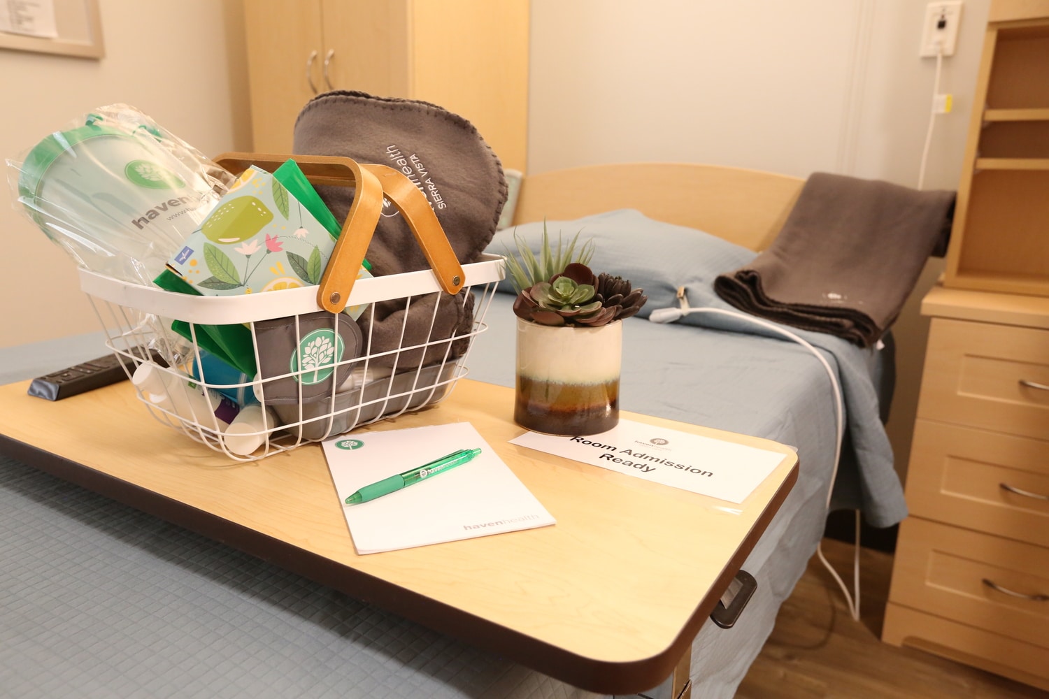 patient room and desk with welcome amenities at Haven Health Sierra Vista
