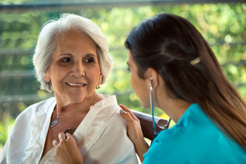 Nursing Assistant taking a patient's vitals