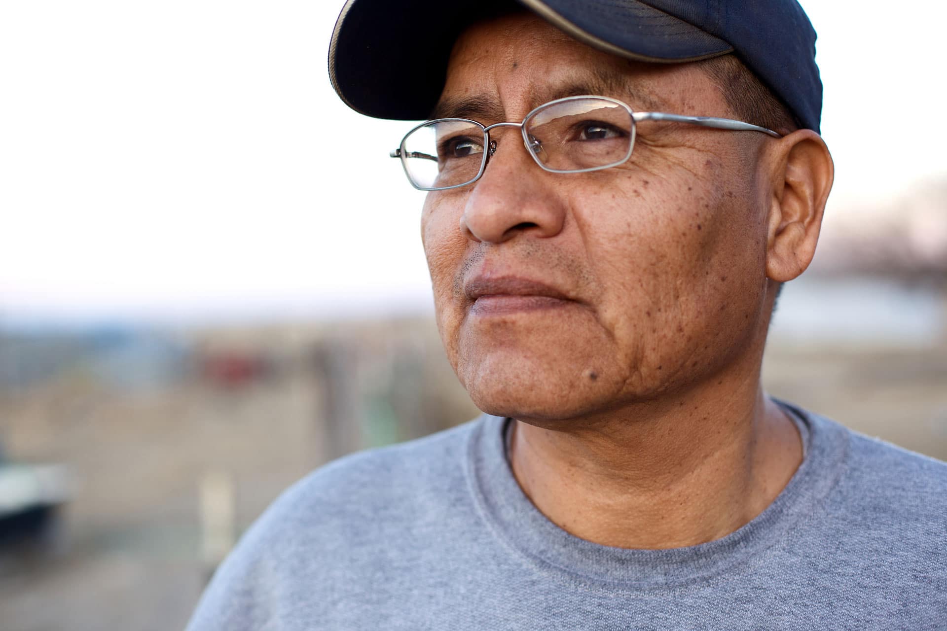 close up of an older gentleman wearing glasses