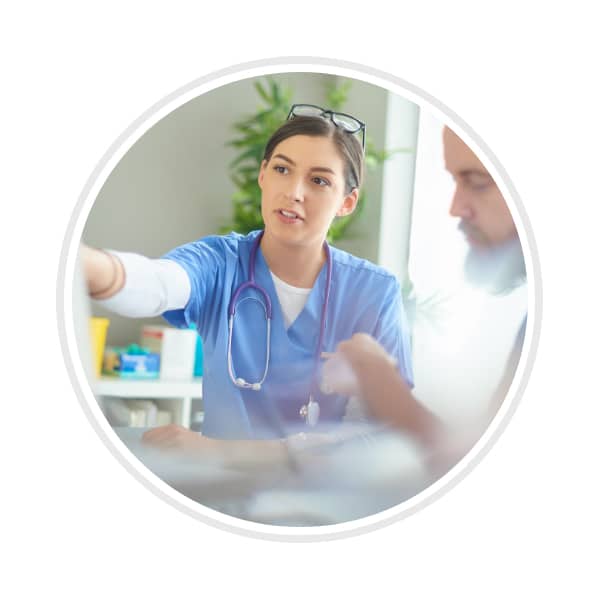 skilled nurse talking with other coworkers