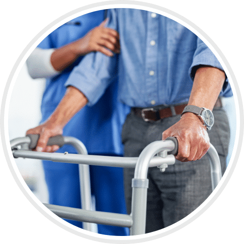 male patient walking with walker and help from the nurse