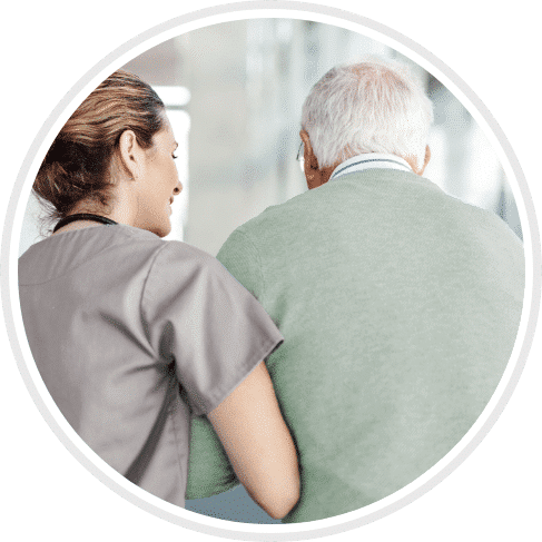 Skilled Nurse helping elderly patient walk