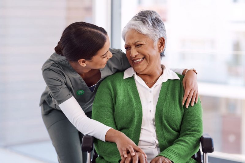 patient and nurse smiling