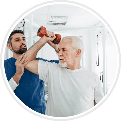 Physical therapist helping patient lift weight