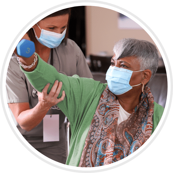 Skilled Nurse assisting patient lift a three pound weight