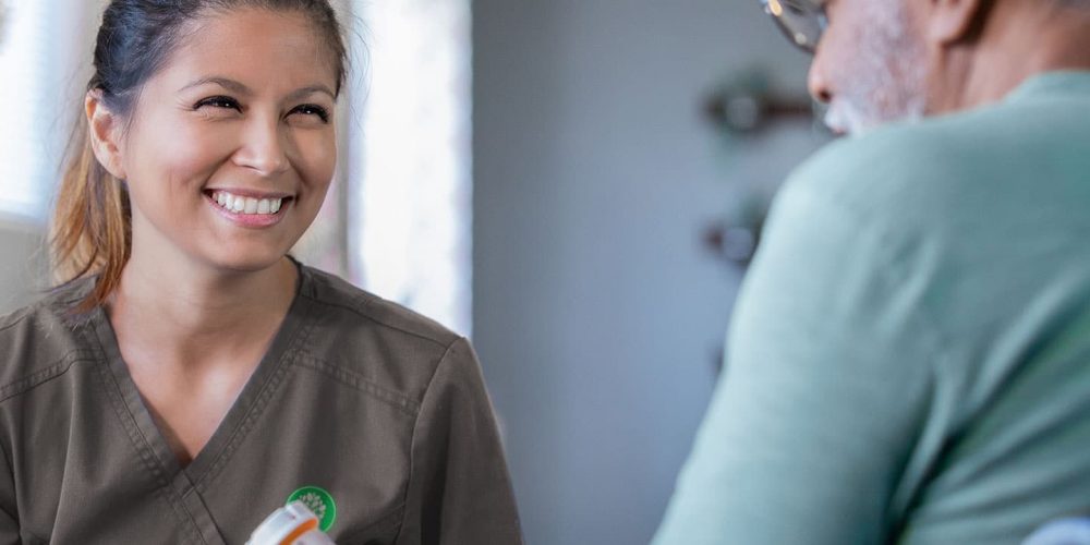 Skilled nurse helping patient with medication