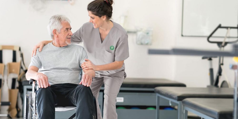 Certified Nursing Assistant (Cna) Helping A Patient