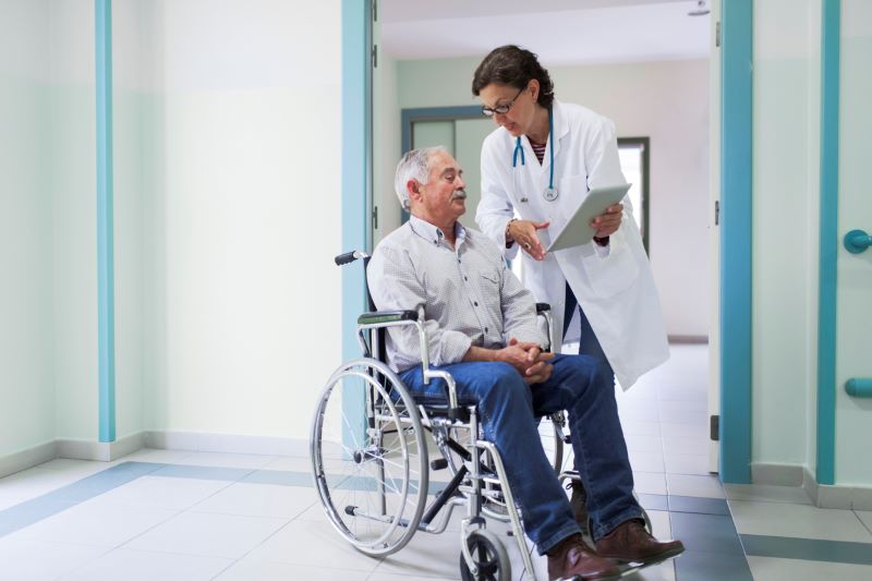 Elder Man With His Doctor Getting Discharged From Hospital