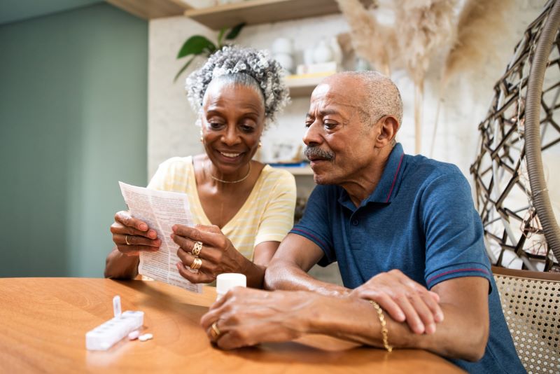 elder couple receiving prescription medication due to Medicare coverage