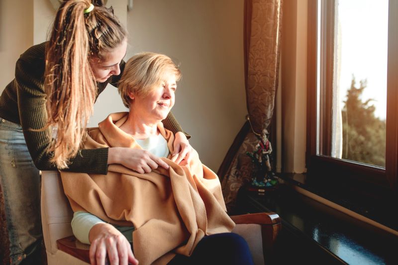 Daughter Taking Care Of Her Mother Who Has Dementia