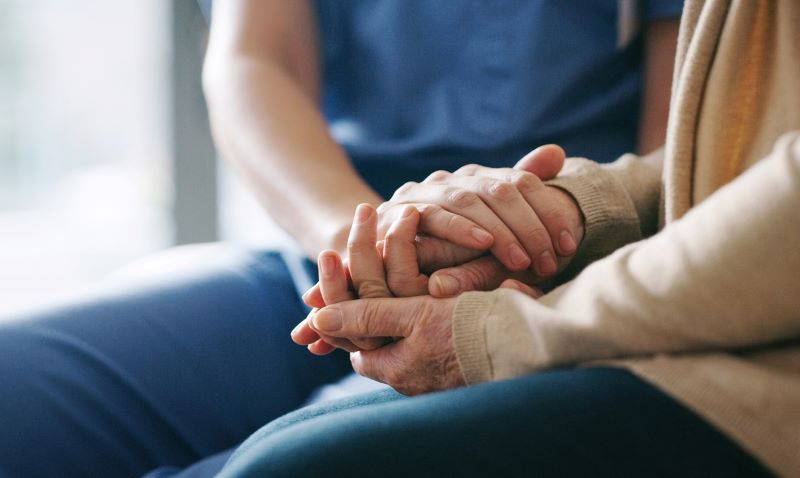 Caring Professional Taking Care Of A Infusion Therapy Patient