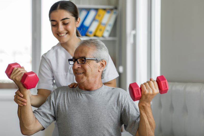 elder man getting physical therapy