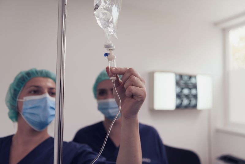Nurse Checking On The Dosage Of The Iv Drip