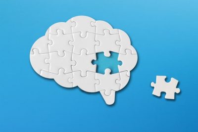 Illustration of brain as a puzzle with a piece missing 