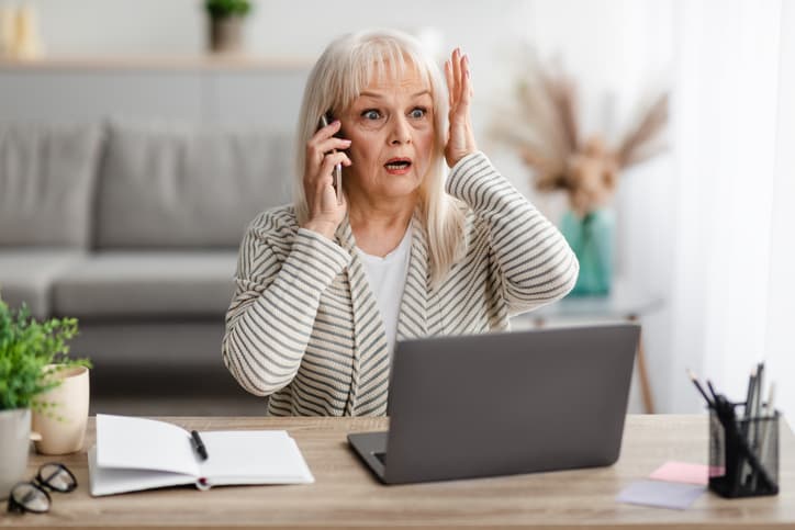 Urprised Shocked Mature Woman Talking On Mobile Phone