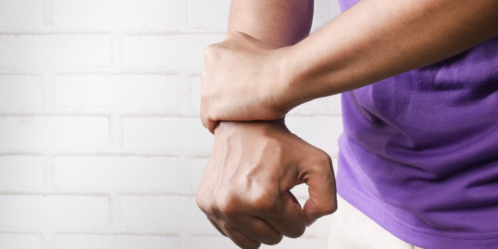Person Holding Their Wrist In Pain