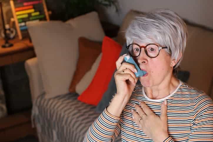 Older Woman Using Inhaler 