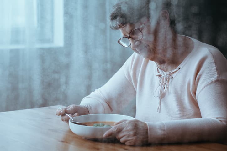 woman eating soup