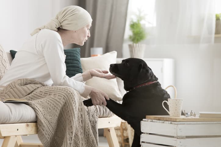 Cancer Patient Petting Her Dog