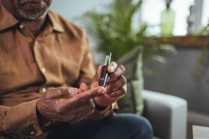 Older Man Checking Blood Sugar