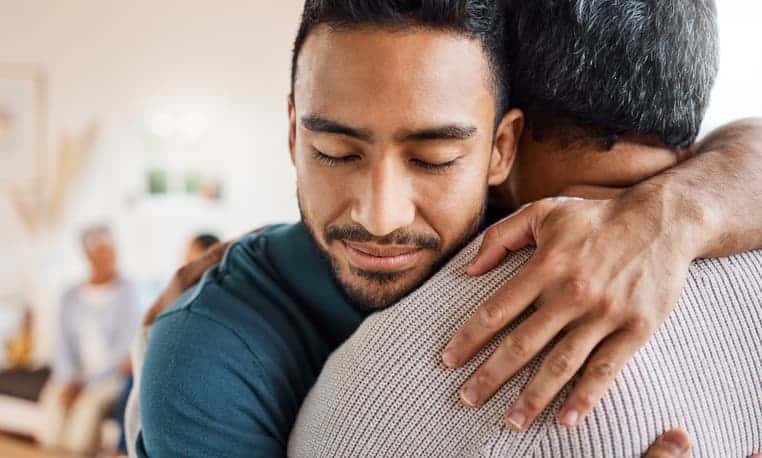 Son Hugging Elderly Dad
