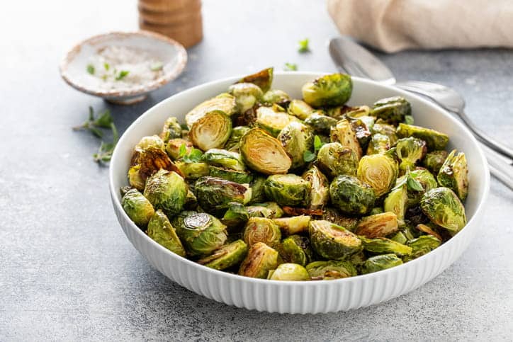 A bowl of cooked Brussel sprouts to help prevent prostate cancer.