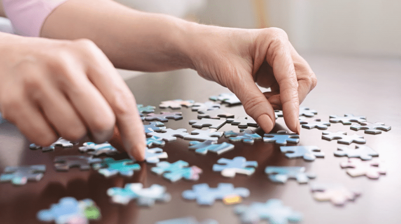 A patient working on a puzzle to help with their memory care at Haven Health.