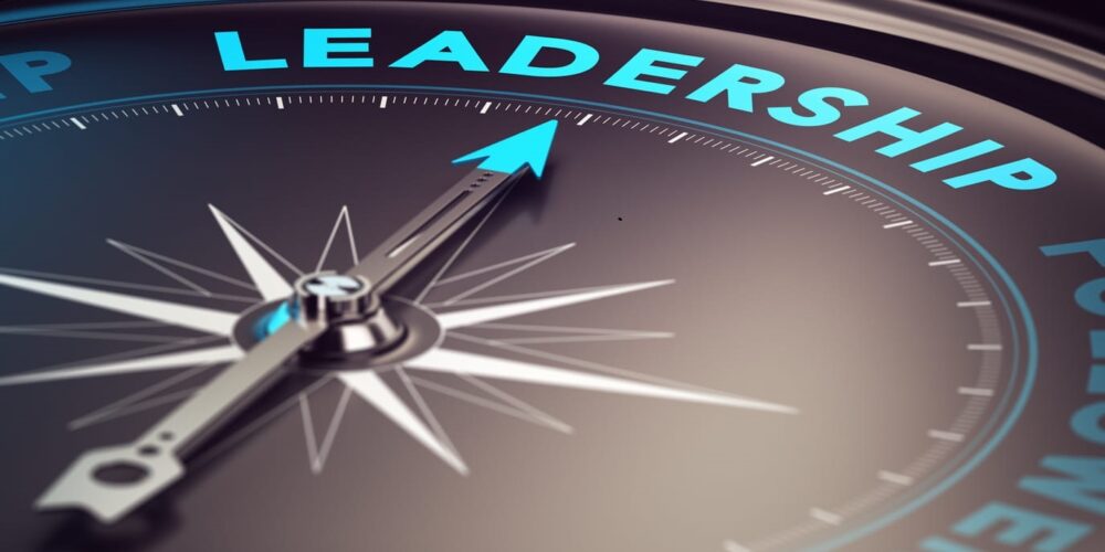 A compass pointing toward the word "leadership."