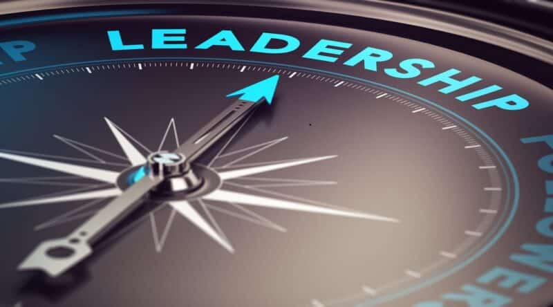 A compass pointing toward the word "leadership."