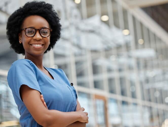 A nurse smiling for the camera.