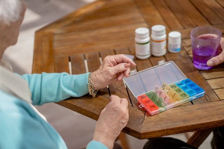 A Close Up Of Senior'S Hand While Taking Her Diabetic Medications. 