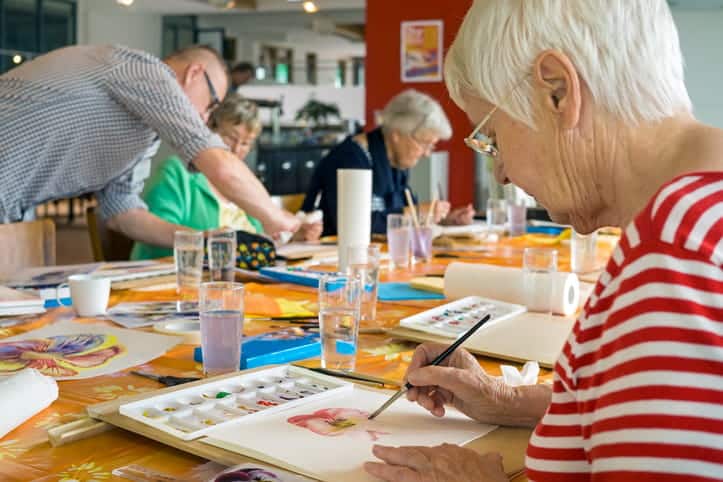Local Activities For Seniors In Tucson’s Assisted Living Communities 1 Seniors Participating In A Painting Class Together At An Assisted Living Facility.