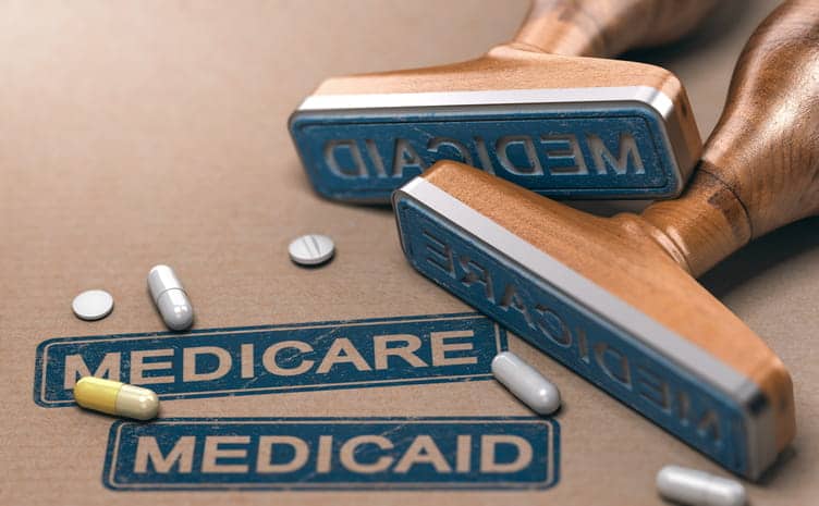 Stamps That Read &Quot;Medicare&Quot; And &Quot;Medicaid&Quot; With Medication Around Them. 