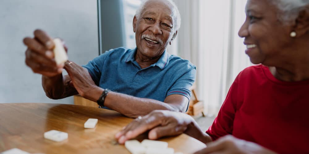 Senior Couple Playing Dominoes