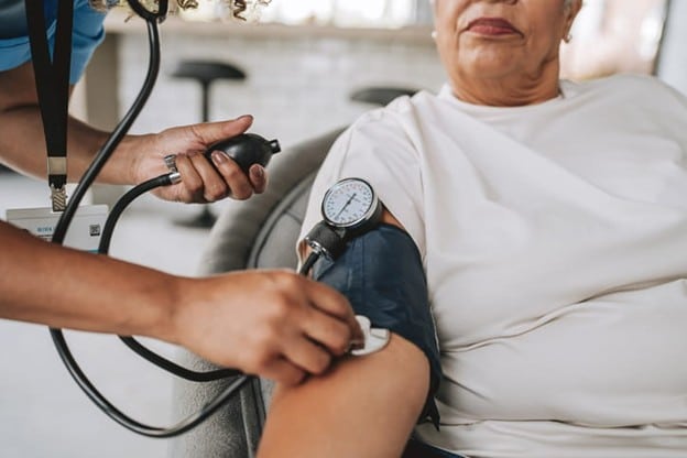 An Elderly Woman Is Getting Her Blood Pressure Taken.