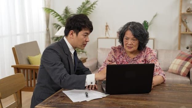A Senior Female Meets With Her Son To Arrange Long-Term Care.