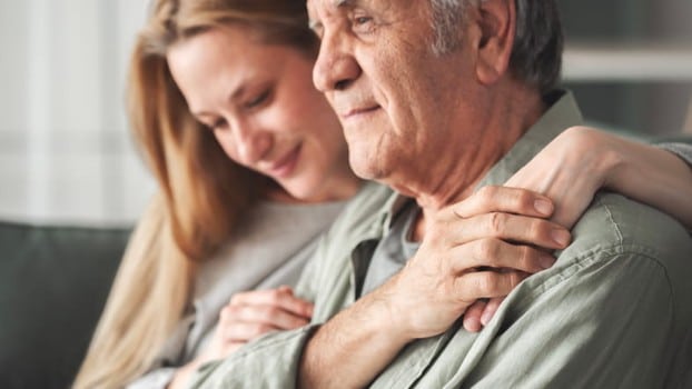 A Woman Sits With Her Father Who Has Dementia.