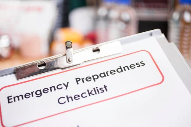 A Piece Of Paper On A Clipboard That Reads: &Quot;Emergency Preparedness Checklist.&Quot;