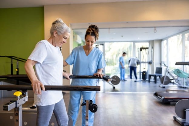 A Therapist Works With A Patient At A Skilled Nursing Facility.
